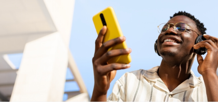 A man enjoying his mobile phone deal from Spectrum Mobile